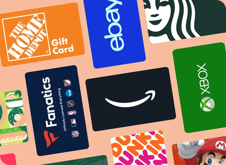 A fan of retail gift cards held in one hand
