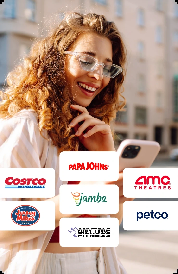 A customer on her phone, with offer tiles from Costco, Papa John’s, AMC Theatres, Jamba, Jersey Mike’s, Petco and Anytime Fitness floating in front of her