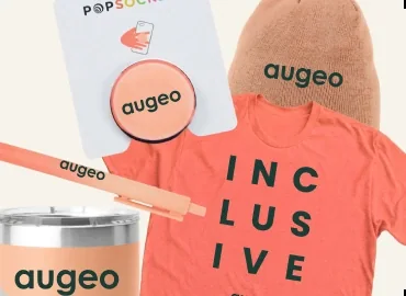Augeo-branded swag — a tee, beanie, tumbler, pen and phone grip