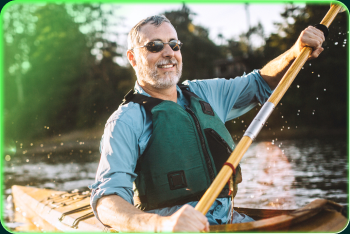 A member kayaking on a lake